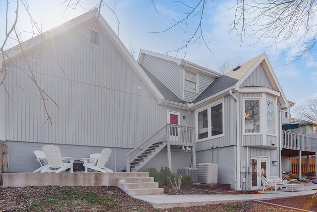 back of house with a patio, french doors, stairs, central AC unit, and an outdoor fire pit