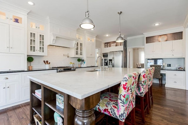 kitchen featuring dark wood-style flooring, appliances with stainless steel finishes, open shelves, a sink, and white cabinets