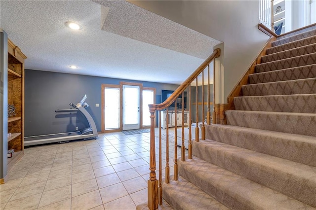 stairs with tile patterned flooring, recessed lighting, and a textured ceiling