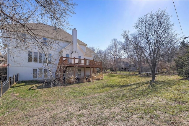 view of yard with a deck and fence