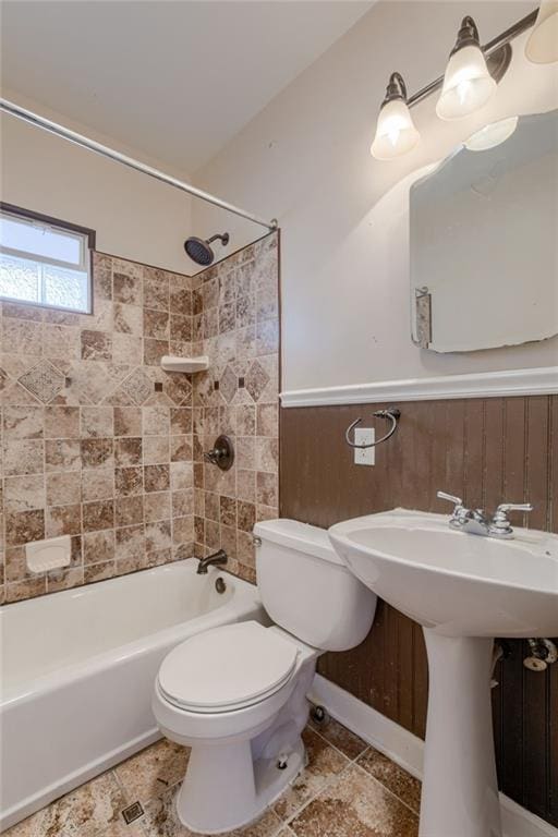 full bathroom featuring bathtub / shower combination and toilet