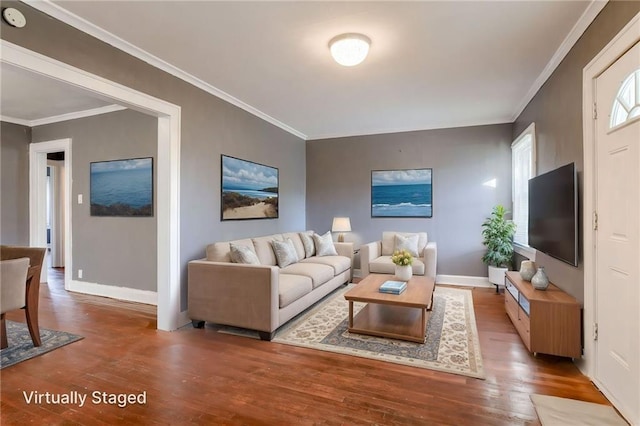 2850 Mersington Ave, Kansas City, MO 64128 - living room featuring baseboards, ornamental molding, and wood finished floors