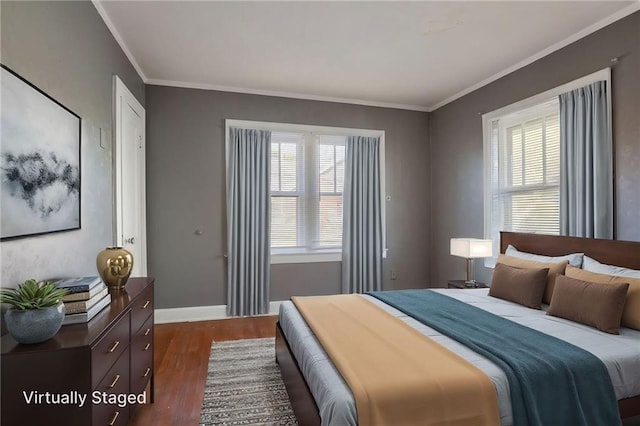 2850 Mersington Ave, Kansas City, MO 64128 - bedroom featuring ornamental molding, baseboards, and dark wood finished floors