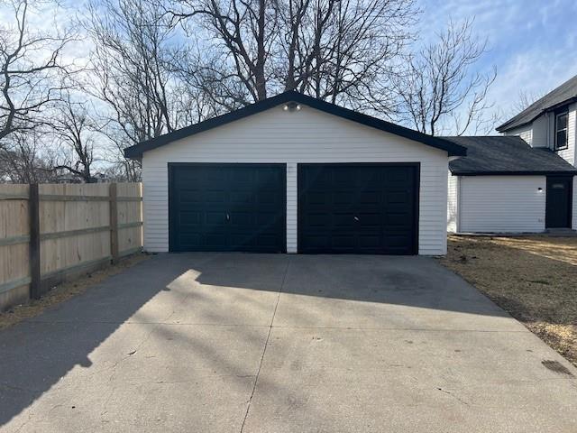 detached garage with fence