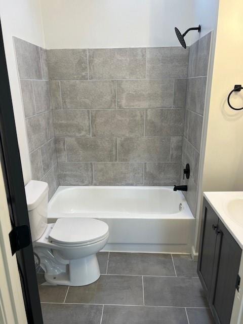 full bathroom with tile patterned floors, shower / bathing tub combination, toilet, and vanity