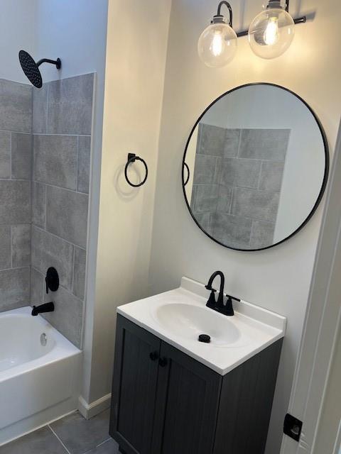 bathroom with shower / bath combination, vanity, and tile patterned flooring