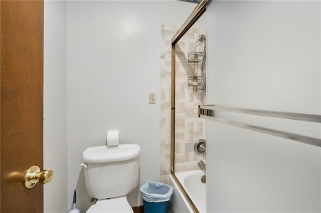 bathroom featuring toilet and enclosed tub / shower combo