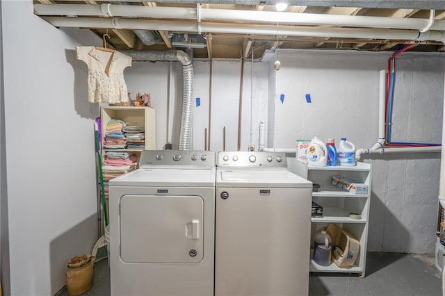 washroom featuring laundry area and washing machine and dryer