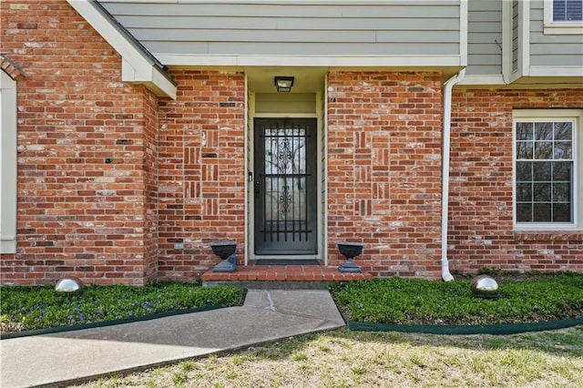 entrance to property with brick siding