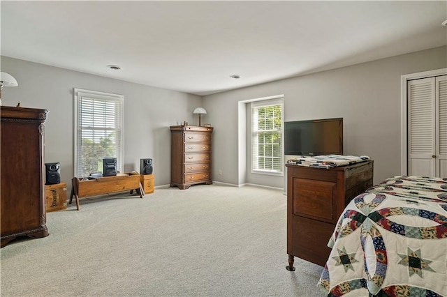 bedroom featuring carpet floors and baseboards