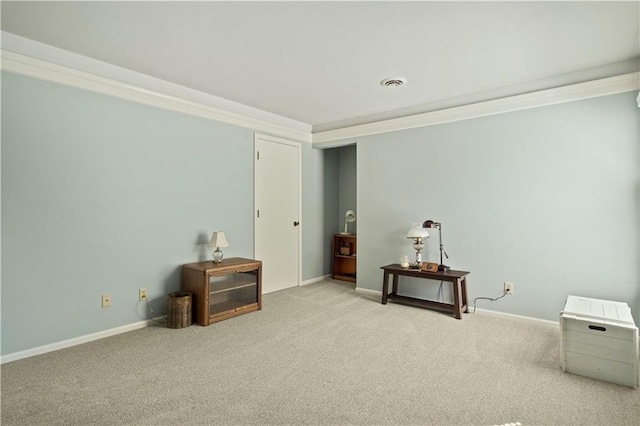 interior space featuring carpet floors, crown molding, visible vents, and baseboards