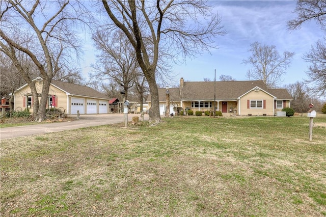 ranch-style house with a garage, a chimney, and a front yard