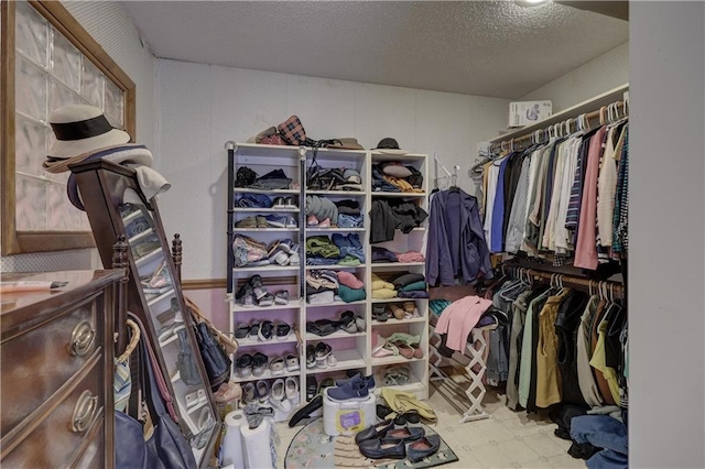 spacious closet featuring tile patterned floors