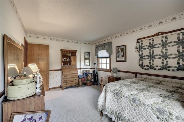 carpeted bedroom with wainscoting