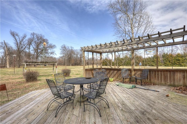 deck featuring a yard, outdoor dining space, and a pergola