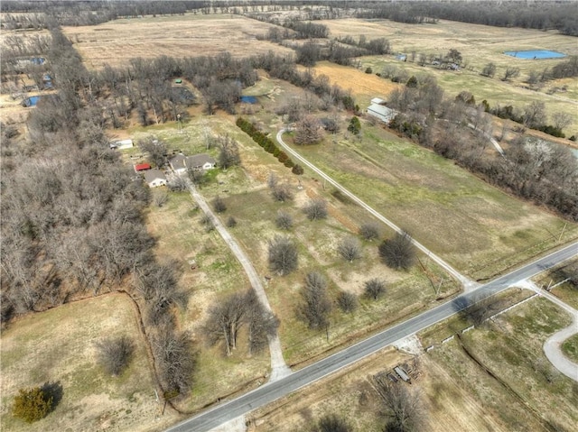 birds eye view of property with a rural view