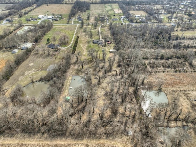 birds eye view of property with a rural view