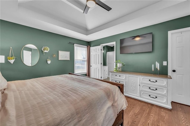 bedroom featuring wood finished floors and a ceiling fan