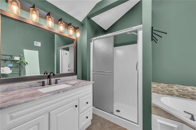 bathroom with a shower stall, a bath, visible vents, and lofted ceiling