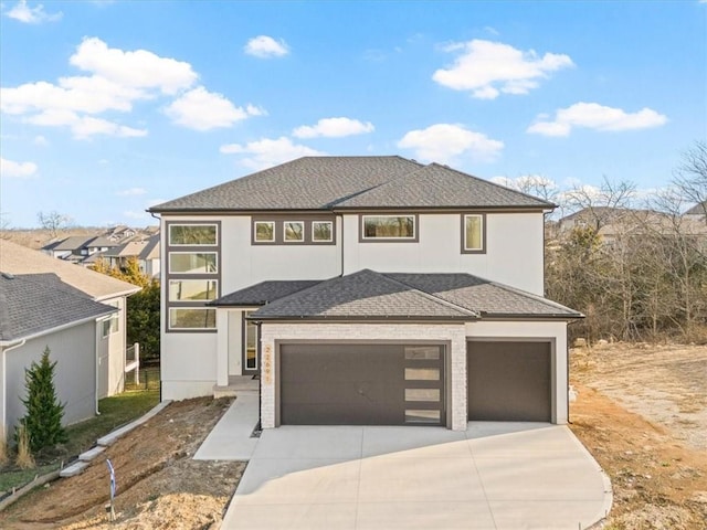 view of front of house featuring a garage, stucco siding, driveway, and roof with shingles