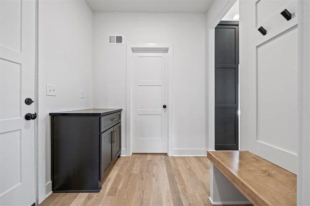 mudroom with visible vents and light wood finished floors