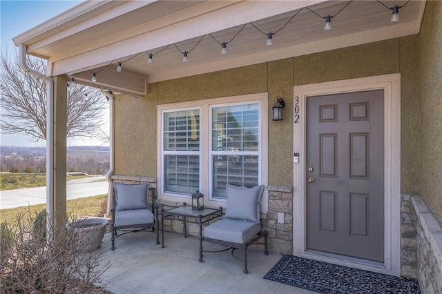 doorway to property with stucco siding