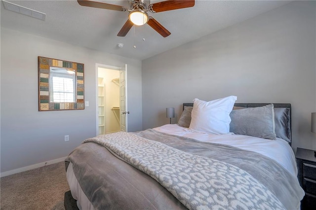 bedroom featuring a ceiling fan, carpet, visible vents, and baseboards