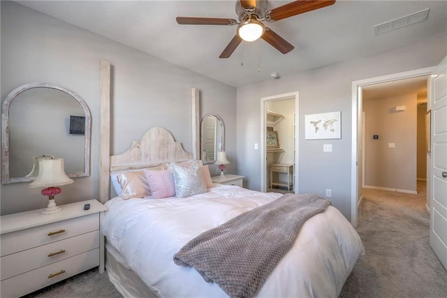 carpeted bedroom with baseboards, visible vents, and ceiling fan