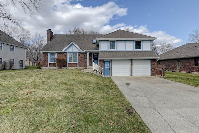 split level home featuring driveway, a front lawn, a shingled roof, a garage, and brick siding