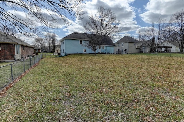 view of yard with a residential view and fence