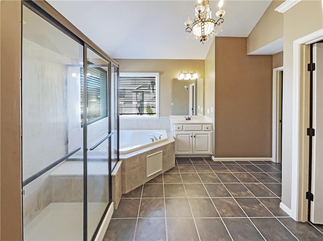 bathroom with vanity, an inviting chandelier, a stall shower, tile patterned floors, and a bath