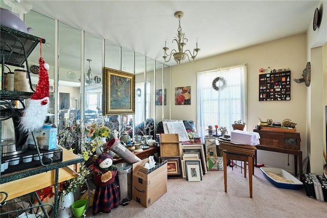 misc room with carpet and an inviting chandelier