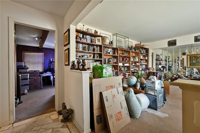 interior space with stone finish flooring and carpet