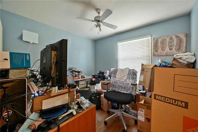 home office featuring a ceiling fan and wood finished floors