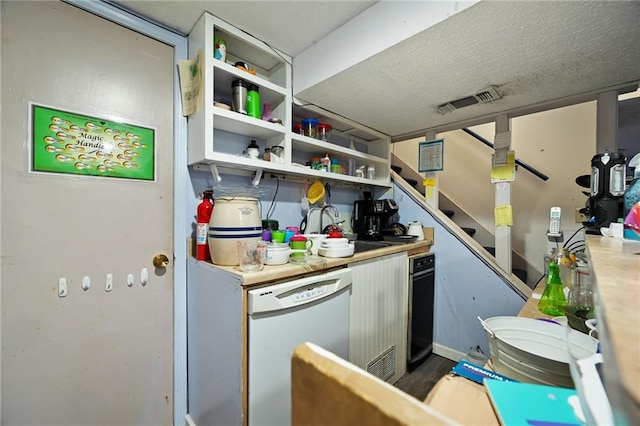 kitchen with visible vents, a sink, dishwasher, wood finished floors, and open shelves