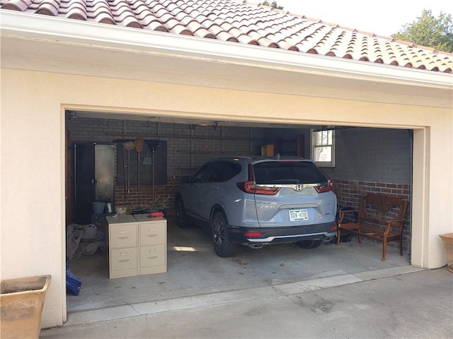 garage with concrete driveway