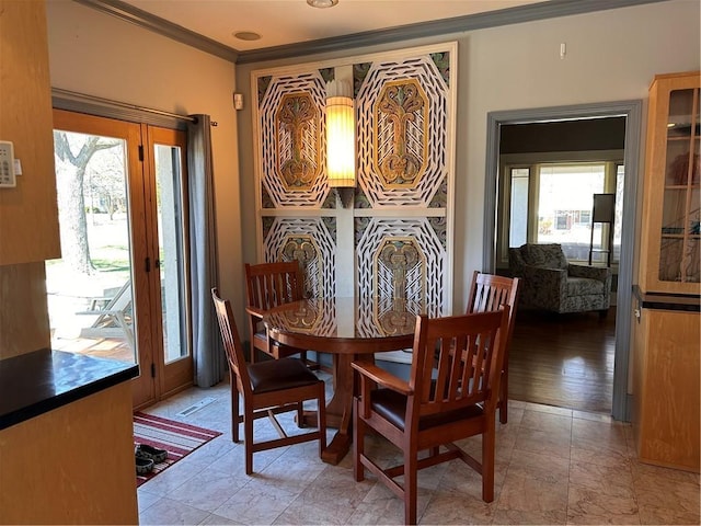 dining area with ornamental molding