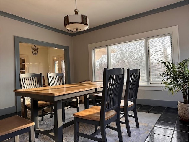 dining space featuring baseboards and ornamental molding