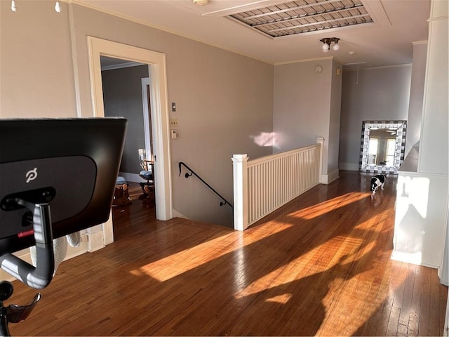 interior space featuring crown molding, visible vents, and wood-type flooring