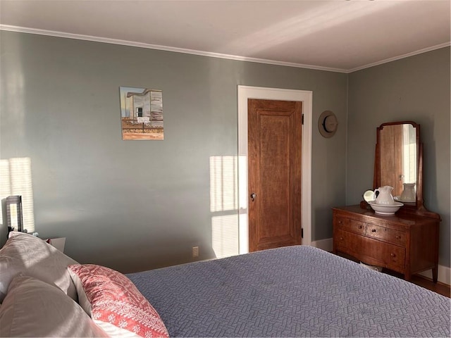 bedroom with ornamental molding