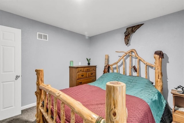 bedroom featuring visible vents, carpet flooring, and baseboards