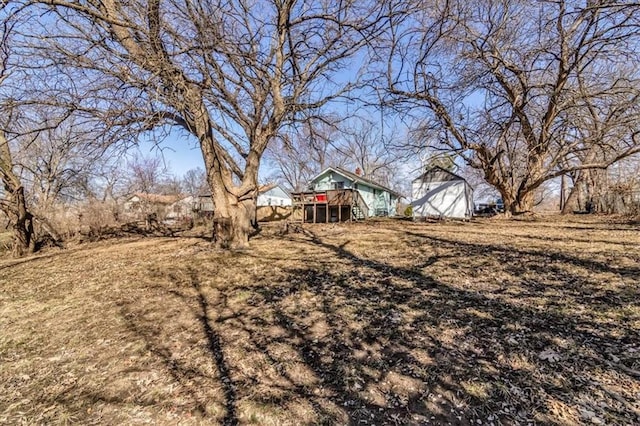 view of yard featuring a wooden deck