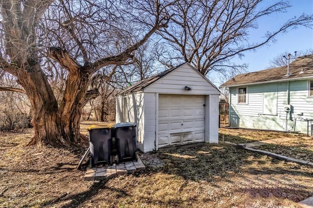 detached garage featuring driveway