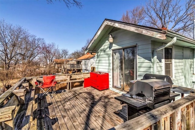 wooden terrace featuring area for grilling