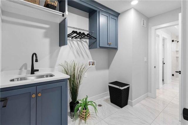 laundry area featuring visible vents, baseboards, recessed lighting, a sink, and washer hookup