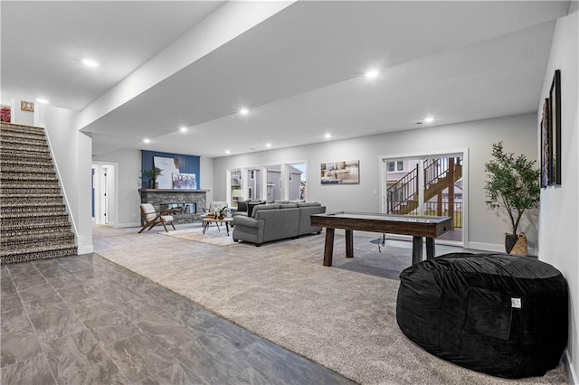 living room featuring recessed lighting, baseboards, carpet floors, and stairs