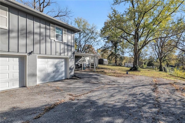 view of home's exterior with aphalt driveway and board and batten siding