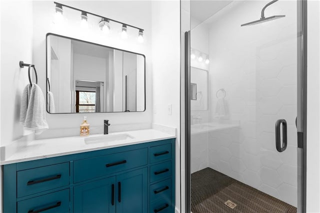 full bathroom featuring a shower stall and vanity