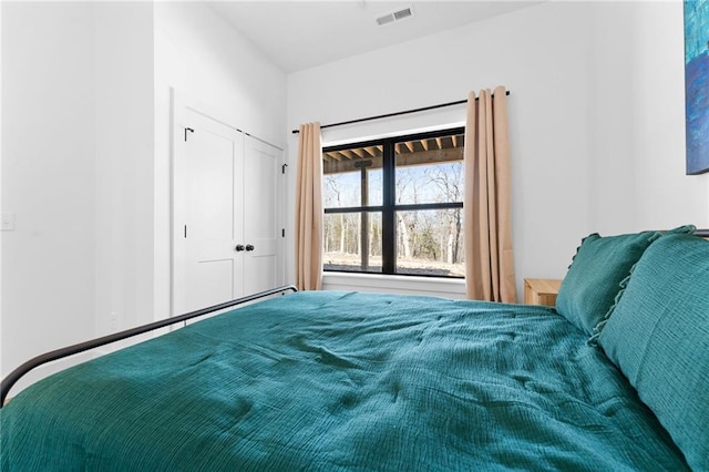 bedroom featuring visible vents