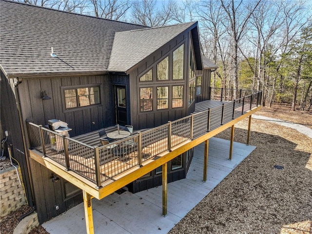 wooden terrace with a patio